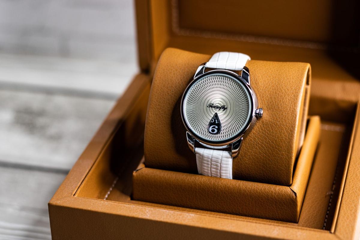 A watch presented in an open leather watch box